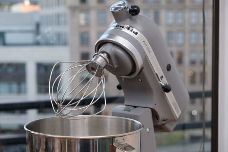 Review image showing what the real design of KitchenAid Artisan stand mixer motor and fitted whisk attachment looks like during testing